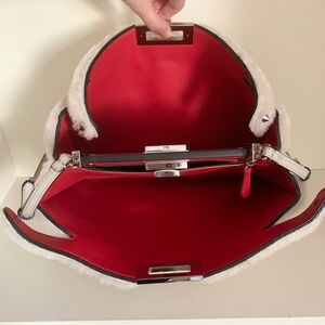 Hold Fendi shearling peekaboo bag